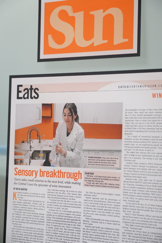 A newspaper article with the feature image being a woman in a lab.