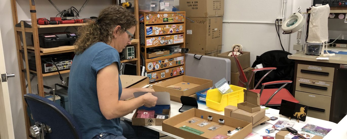 Photo of Carrie in her workspace